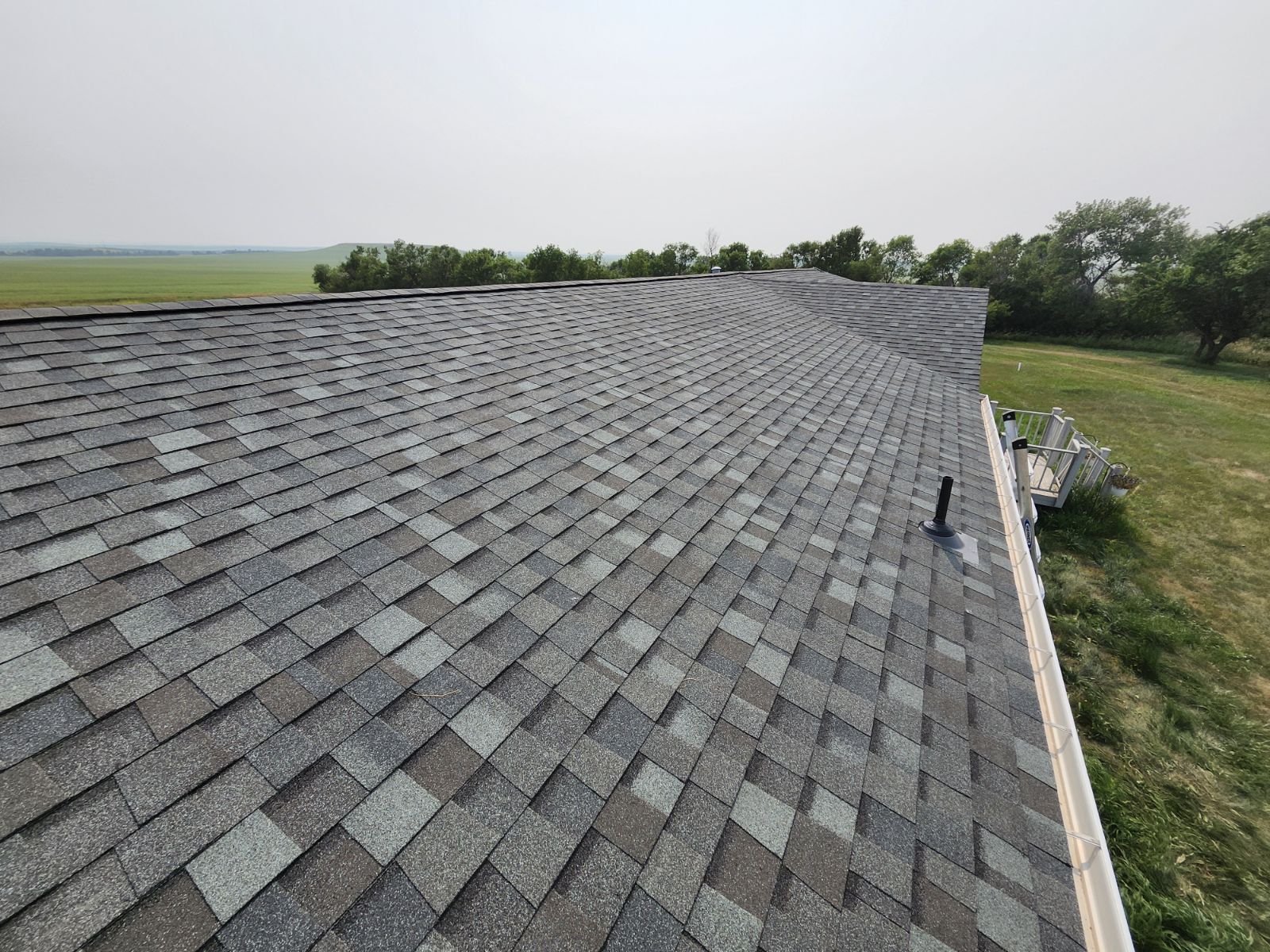 Bison Roofing Install July 2024 - Tamko Titan XT Class 3 UL2218 - Oxford Gray - South Heart, ND
